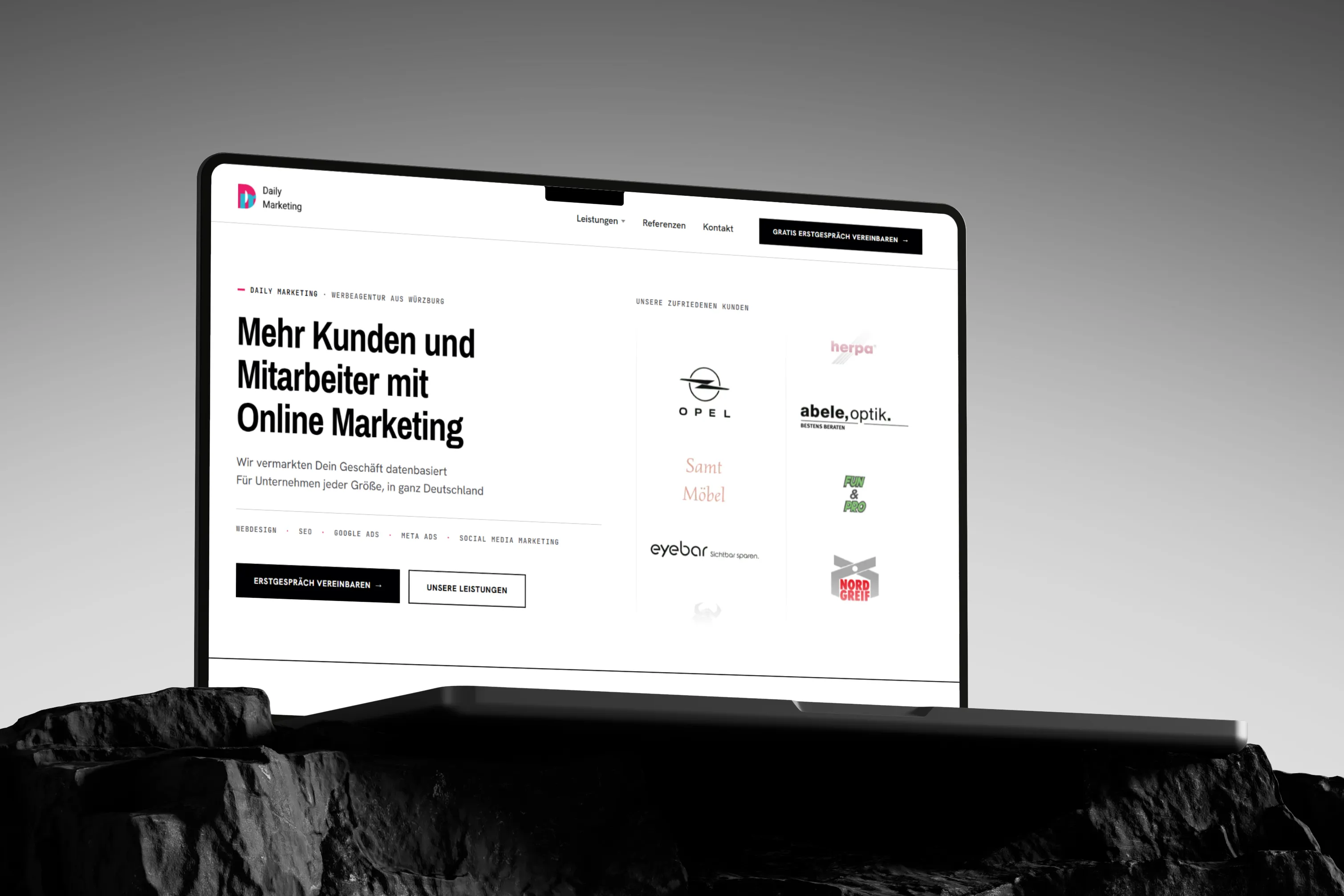 The relaunched Daily Marketing website, shown on a MacBook.